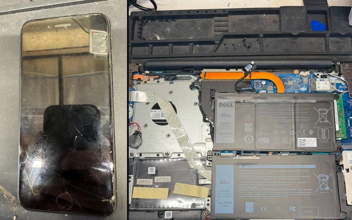 A cracked iPhone screen beside a Dell laptop opened on the repair bench with its batteries and fan exposed